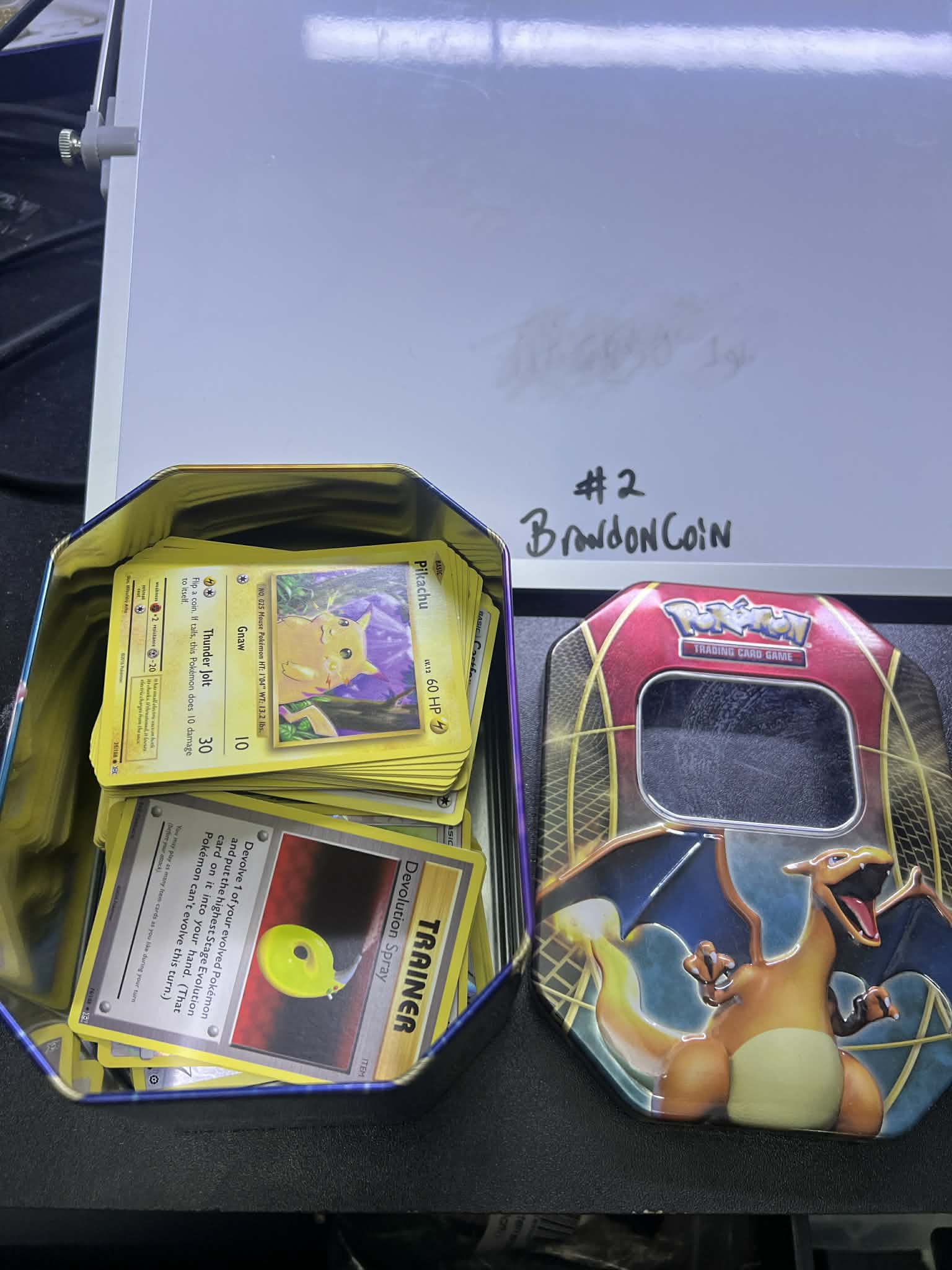 Pokemon Tin random cards charizard top